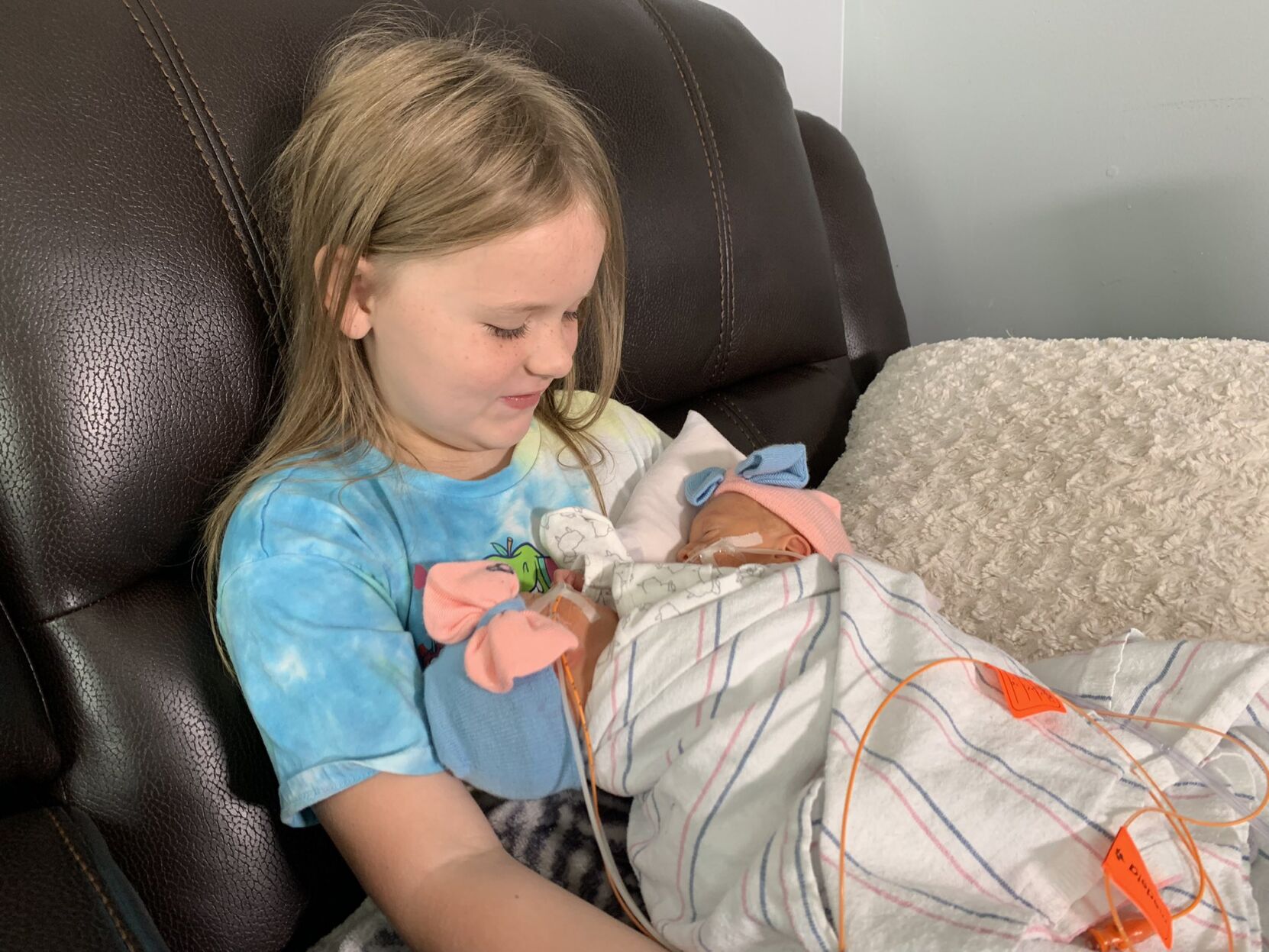 Sister Layla holds twins